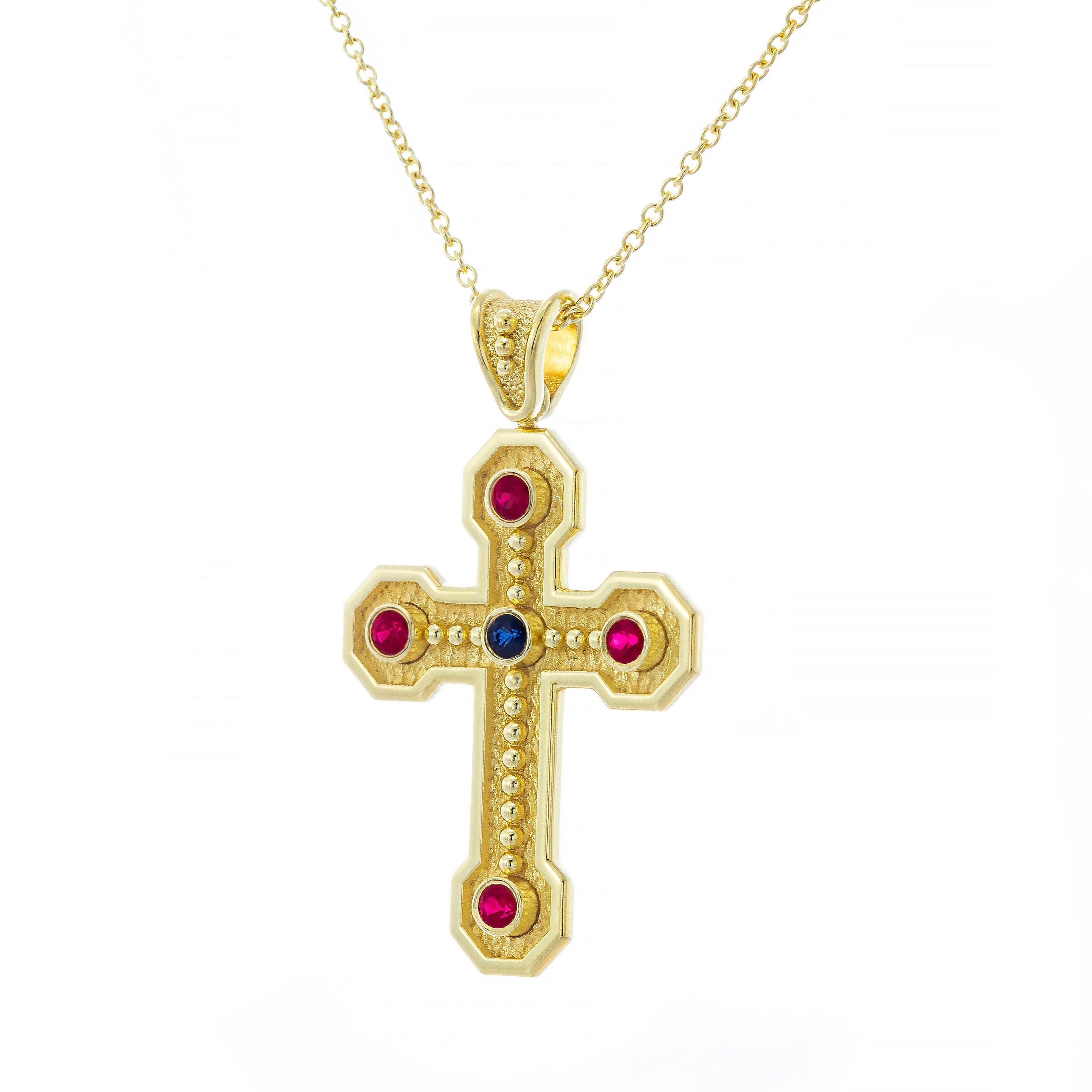 Absolutely beautiful bejeweled gold cross with newest Ruby in the middle